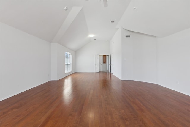 unfurnished living room with lofted ceiling, ceiling fan, visible vents, and wood finished floors