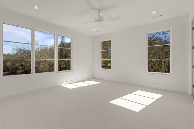 spare room featuring baseboards, visible vents, a ceiling fan, carpet flooring, and recessed lighting