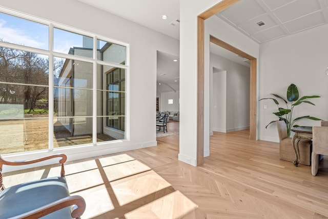 interior space with parquet floors, recessed lighting, visible vents, and baseboards