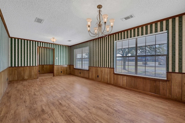 268 Roland Rd, Whitesboro, TX 76273 - unfurnished room with a wainscoted wall and wallpapered walls