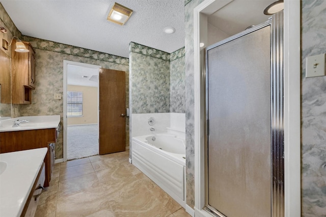 268 Roland Rd, Whitesboro, TX 76273 - bathroom featuring wallpapered walls, a stall shower, a garden tub, a textured ceiling, and vanity