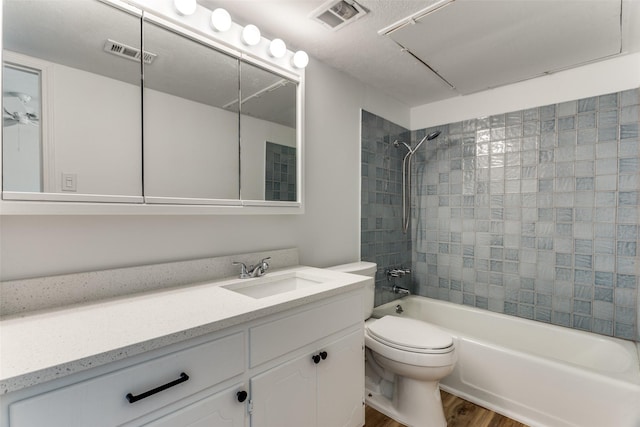 full bath featuring toilet, visible vents, shower / washtub combination, and wood finished floors