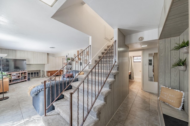 stairs with tile patterned floors