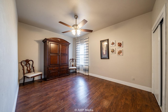 unfurnished bedroom with dark wood-style floors, ceiling fan, baseboards, and a closet