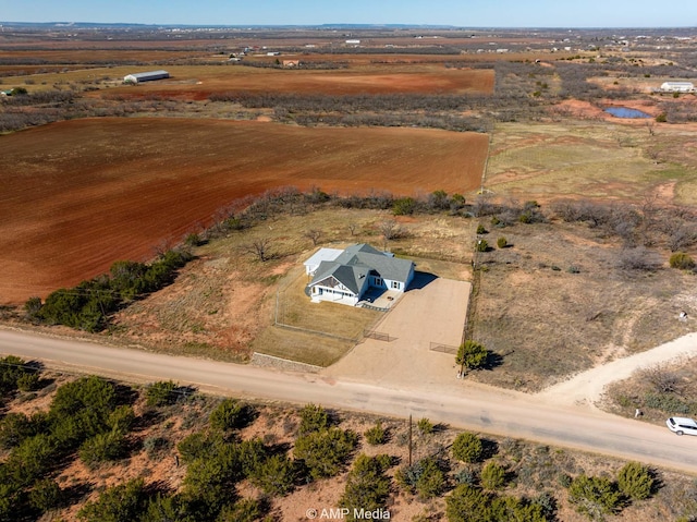 birds eye view of property featuring a rural view