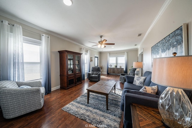 living room with visible vents, ornamental molding, ceiling fan, wood finished floors, and baseboards