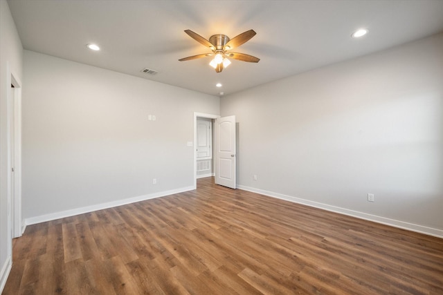 empty room with recessed lighting, visible vents, ceiling fan, wood finished floors, and baseboards