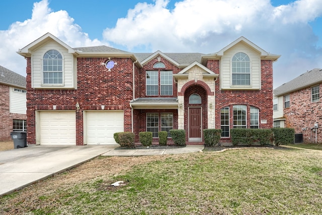 traditional home with concrete driveway and brick siding