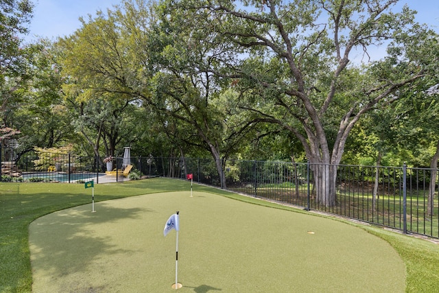 surrounding community featuring a swimming pool and fence