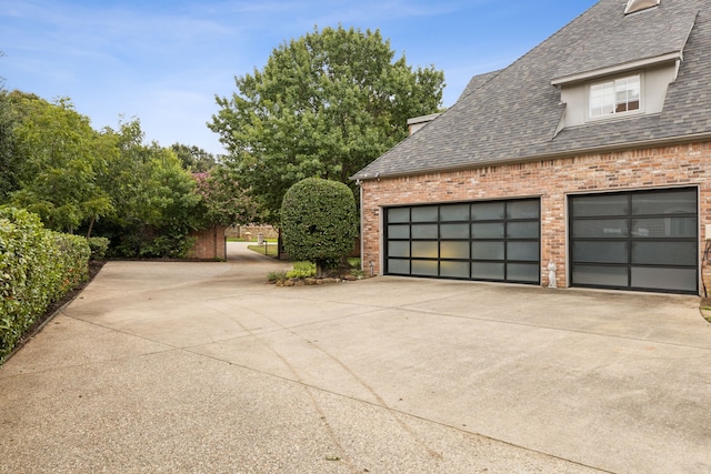 garage with concrete driveway