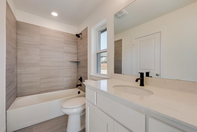 full bathroom with toilet, vanity, and bathing tub / shower combination