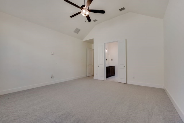 unfurnished bedroom featuring high vaulted ceiling, visible vents, and baseboards