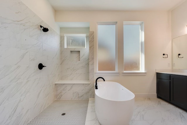 full bath with baseboards, a soaking tub, marble finish floor, a tile shower, and vanity