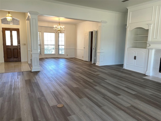 entryway with dark wood-style floors, decorative columns, and crown molding