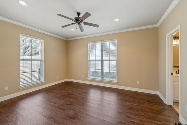 unfurnished room featuring a healthy amount of sunlight, crown molding, and dark wood-style flooring