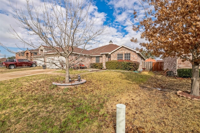 single story home featuring an attached garage, brick siding, fence, driveway, and a front lawn