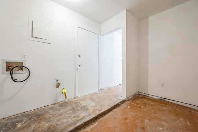 clothes washing area with laundry area, electric panel, and hookup for a washing machine