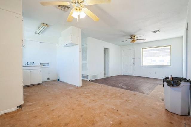 interior space with visible vents and a ceiling fan