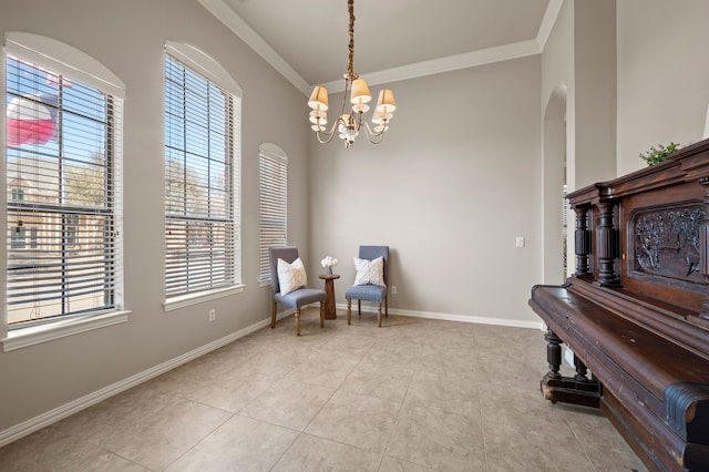 sitting room with tile patterned flooring, a notable chandelier, crown molding, and baseboards