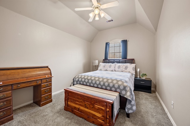 carpeted bedroom with lofted ceiling, baseboards, visible vents, and ceiling fan