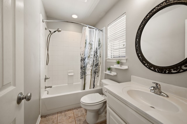 bathroom with toilet, tile patterned flooring, shower / bath combo with shower curtain, and vanity