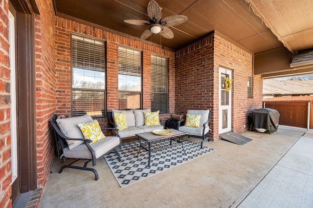 view of patio featuring ceiling fan, fence, a grill, and an outdoor living space