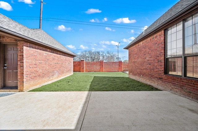 view of yard with a patio area and a fenced backyard