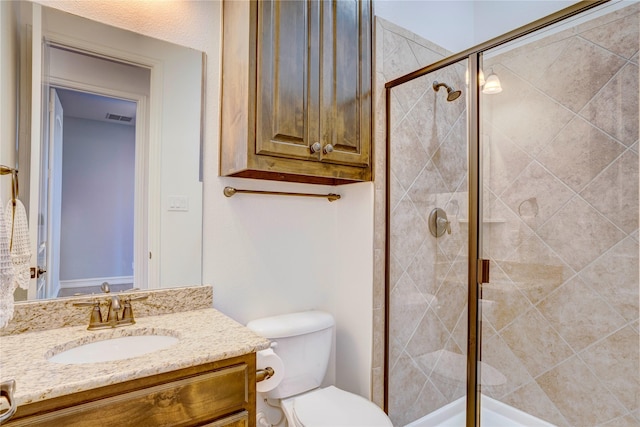 full bath with toilet, a stall shower, visible vents, and vanity