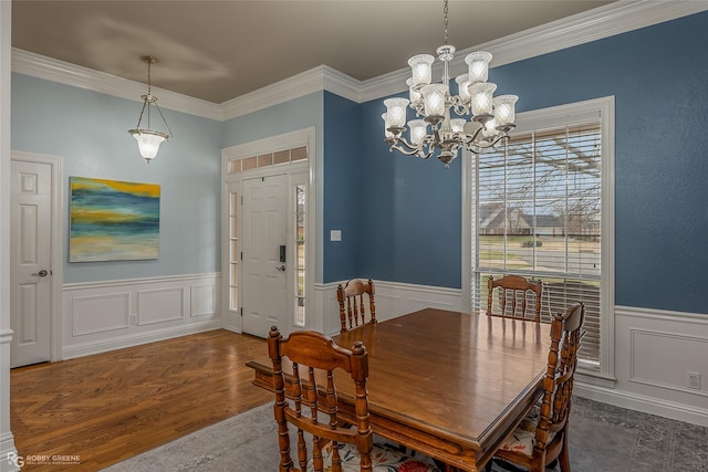 612 Kari Crk, Bossier City, LA 71111 - dining space featuring wainscoting, a notable chandelier, ornamental molding, and a decorative wall