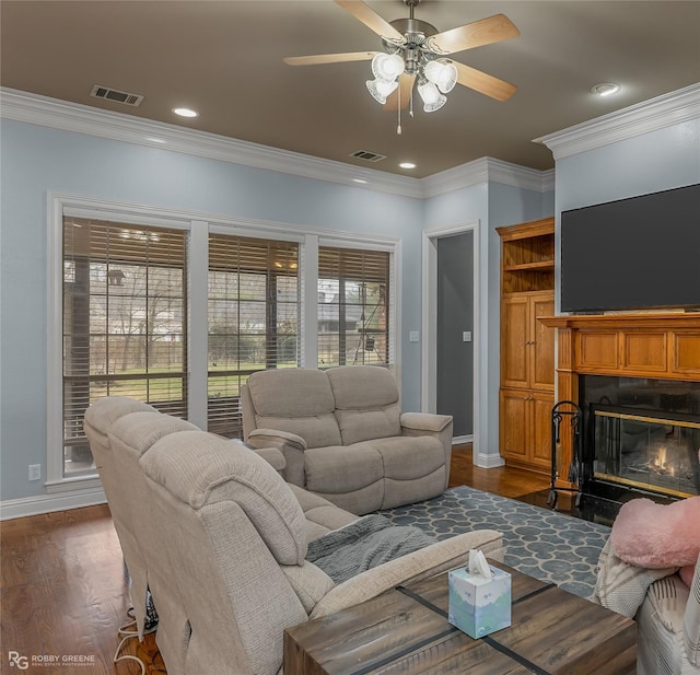 612 Kari Crk, Bossier City, LA 71111 - living room featuring a fireplace with flush hearth, visible vents, baseboards, and dark wood-style floors