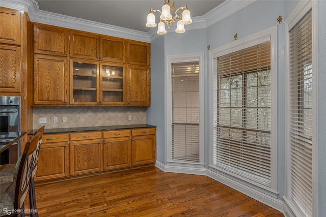 612 Kari Crk, Bossier City, LA 71111 - kitchen with stainless steel oven, brown cabinets, and dark countertops
