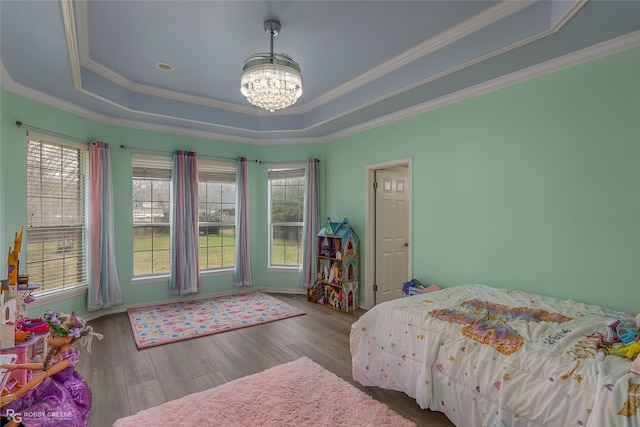 612 Kari Crk, Bossier City, LA 71111 - bedroom with a tray ceiling, a chandelier, wood finished floors, and crown molding
