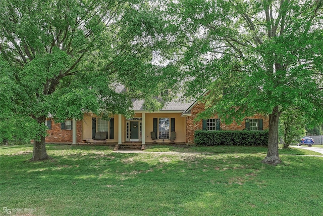 612 Kari Crk, Bossier City, LA 71111 - view of front of property featuring stucco siding, brick siding, a front yard, and covered porch
