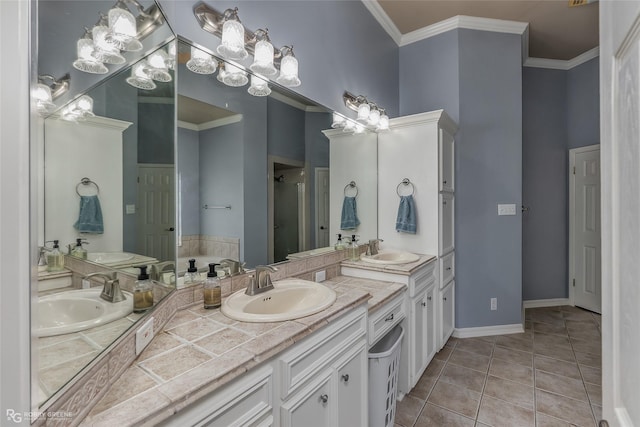 bathroom featuring crown molding, a sink, and tile patterned floors