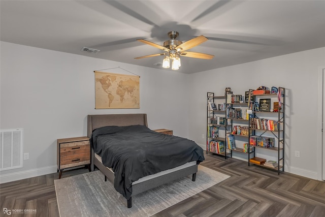 bedroom with baseboards, visible vents, and ceiling fan