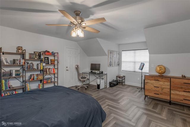 bedroom featuring vaulted ceiling, a ceiling fan, and baseboards