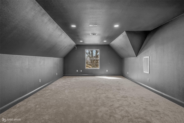 612 Kari Crk, Bossier City, LA 71111 - additional living space featuring carpet floors, vaulted ceiling, visible vents, and baseboards