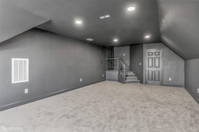 612 Kari Crk, Bossier City, LA 71111 - additional living space with carpet flooring, visible vents, recessed lighting, lofted ceiling, and stairway