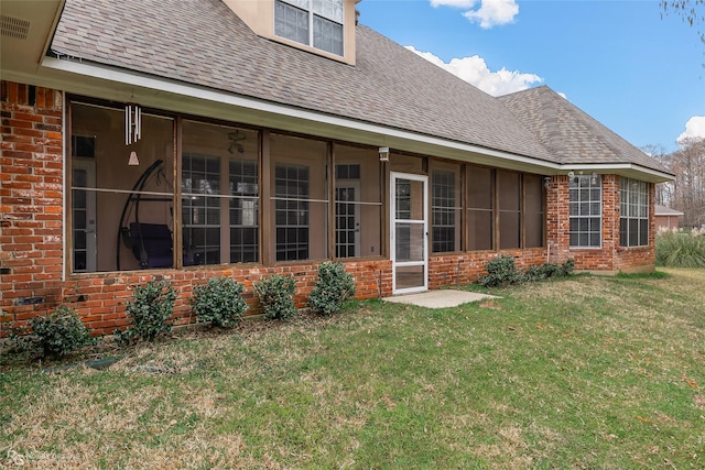 612 Kari Crk, Bossier City, LA 71111 - rear view of house with a sunroom, a shingled roof, brick siding, and a yard