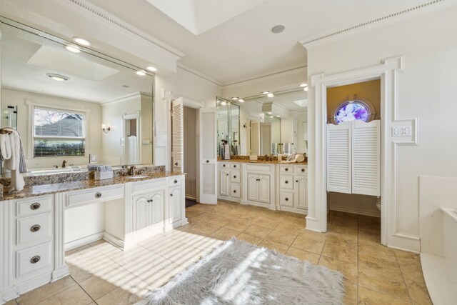 full bath featuring ornamental molding, a closet, tile patterned flooring, and vanity