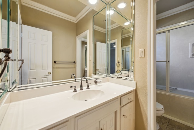 full bathroom with tile patterned flooring, toilet, vanity, ornamental molding, and combined bath / shower with glass door