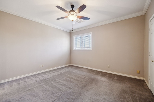 unfurnished room with carpet flooring, crown molding, visible vents, and baseboards