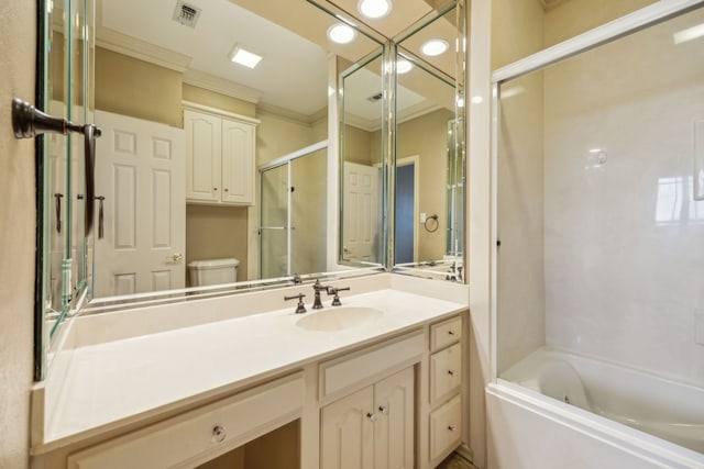 bathroom featuring visible vents, crown molding, vanity, and toilet