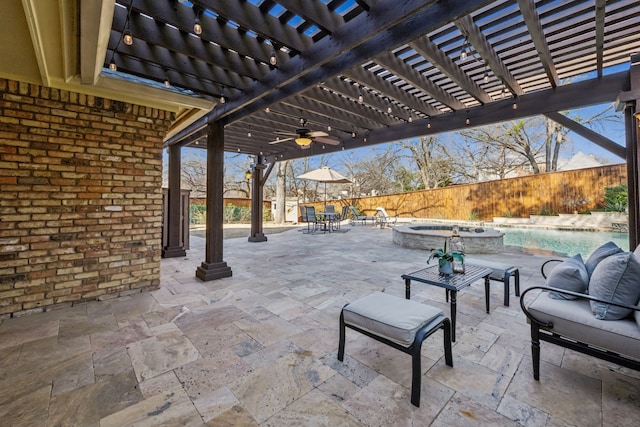 view of patio featuring a pool with connected hot tub, a fenced backyard, and a pergola