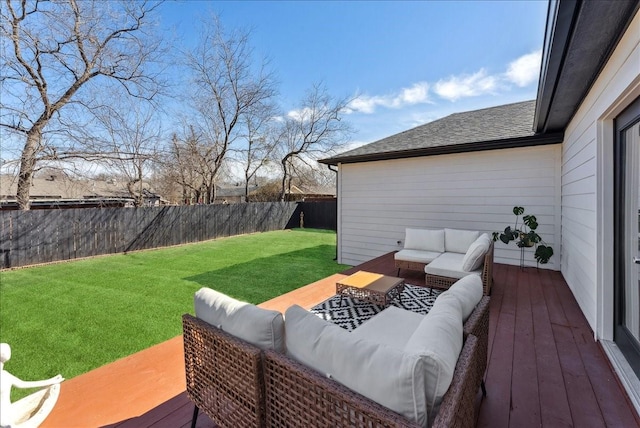 deck featuring an outdoor hangout area, a yard, and fence