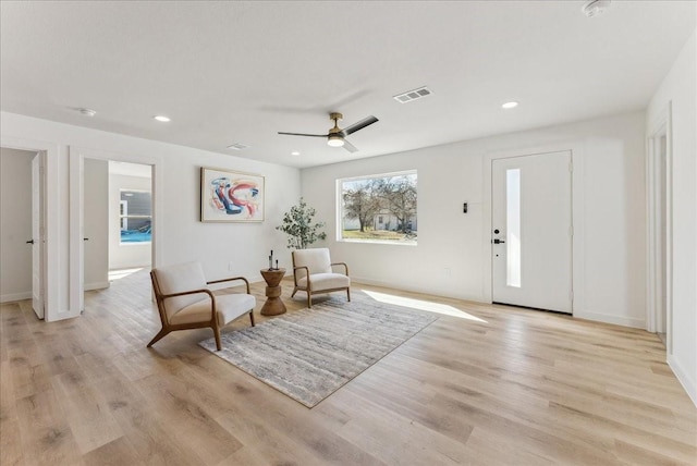 sitting room with recessed lighting, visible vents, and light wood-style floors