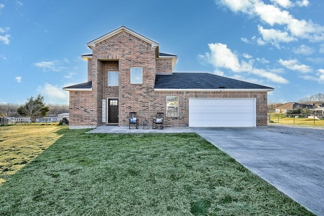 view of front of property with an attached garage, brick siding, and a front yard