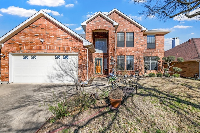 traditional home with a garage, driveway, and brick siding