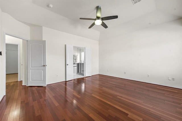 unfurnished bedroom with a ceiling fan, visible vents, ensuite bath, and hardwood / wood-style floors