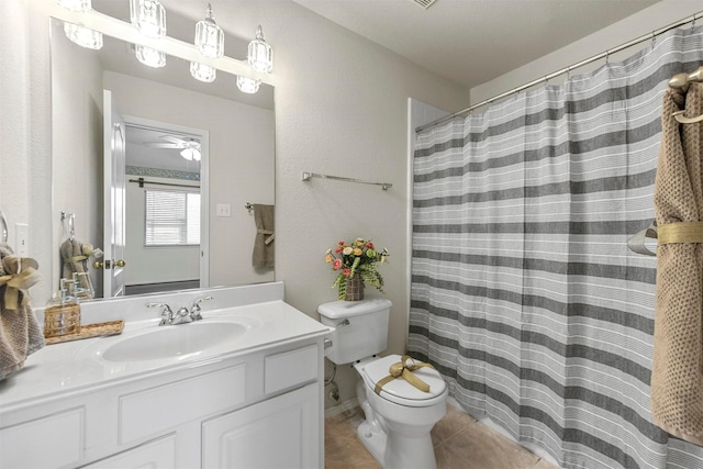 bathroom featuring toilet, curtained shower, tile patterned flooring, and vanity